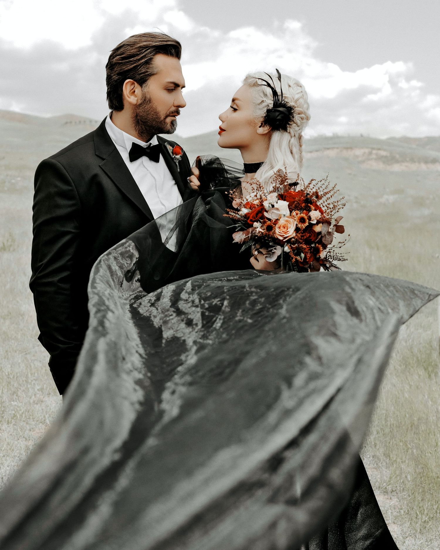 Black dressed bride and their husband looking at each other photographer